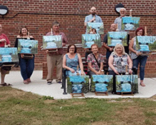 Students at a Bob Ross oil painting class near Horsham, West Sussex