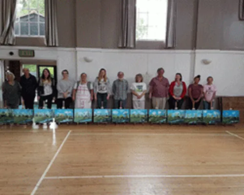 Wet-on-wet landscape painting students in a Bob Ross workshop
