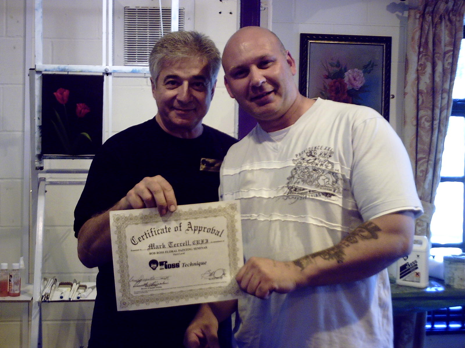 Mark Terrell receiving his Bob Ross Floral CRFI certificate at the Bob Ross Academy
